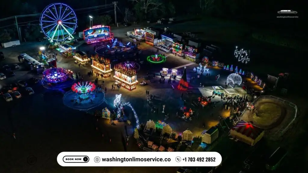 Aerial night view of Festival of Lights carnival with rides, illuminated decorations, and Washington Limo Service banner